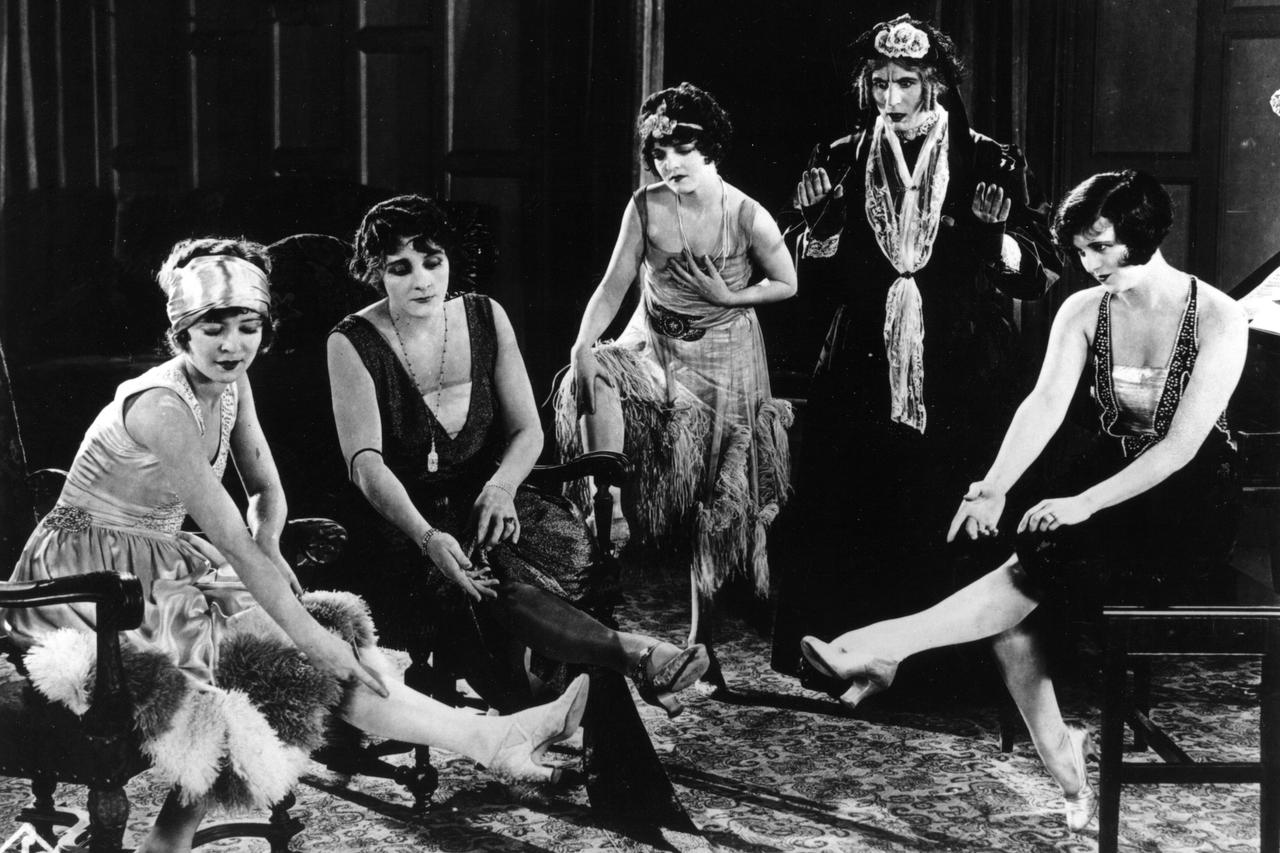 1925: British comedian Syd Chaplin (1885 - 1965) dressed as an elderly aunt in a scene from the film 'Charley's Aunt', directed by Scott Sidney for Christie Film Company.