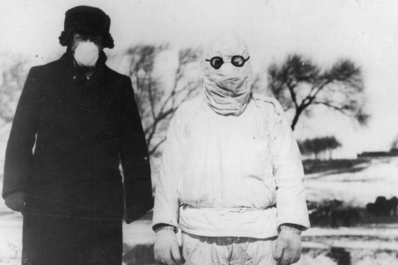 A doctor wears protective clothing during an outbreak of plague in Manchuria.